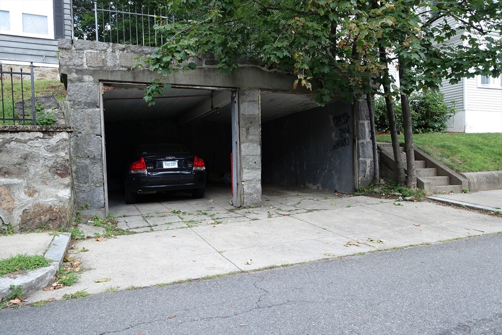 51 Leamington Road, Unit 1 Boston, MA 02135 - Photo 12 of 12 a car parked in front of a house