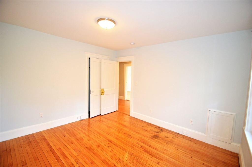 51 Leamington Road, Unit 1 Boston, MA 02135 - Photo 9 of 12 a view of empty room with wooden floor