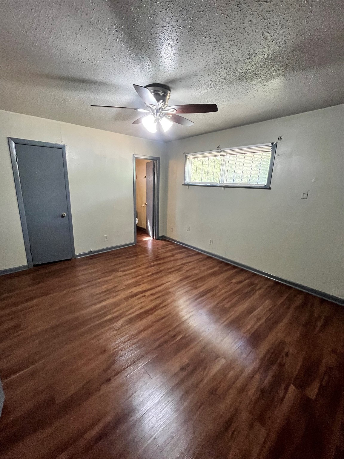 4609 Dabney Street Houston, TX 77026 - Photo 12 of 19 a view of an empty room with wooden floor