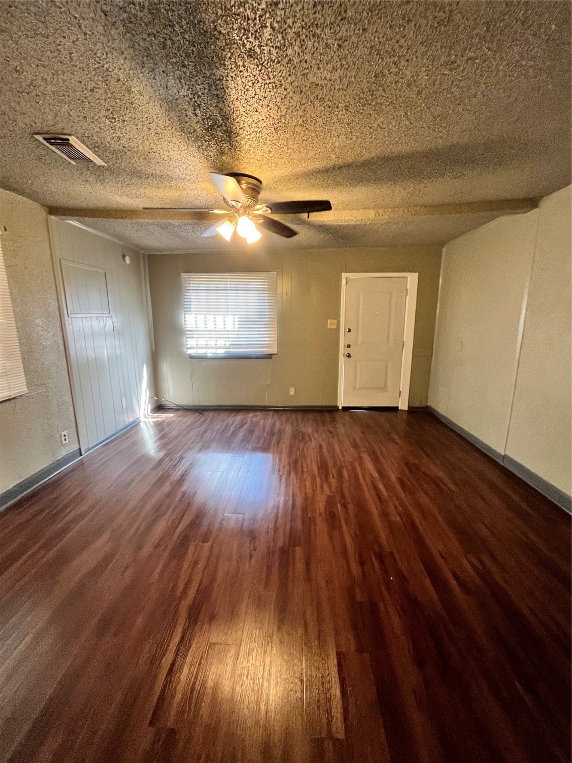 4609 Dabney Street Houston, TX 77026 - Photo 19 of 19 an empty room with wooden floor and windows