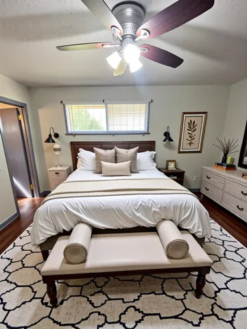 a bedroom with a bed and window