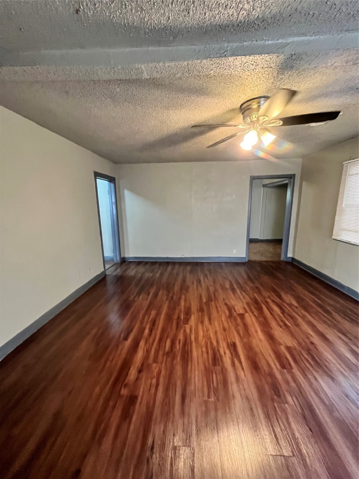 4609 Dabney Street Houston, TX 77026 - Photo 6 of 19 a view of empty room with wooden floor