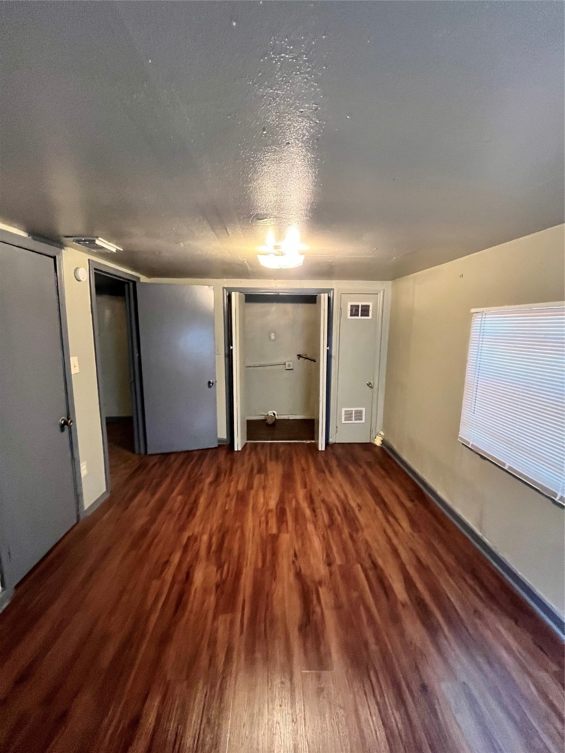 4609 Dabney Street Houston, TX 77026 - Photo 8 of 19 a view of empty room with wooden floor