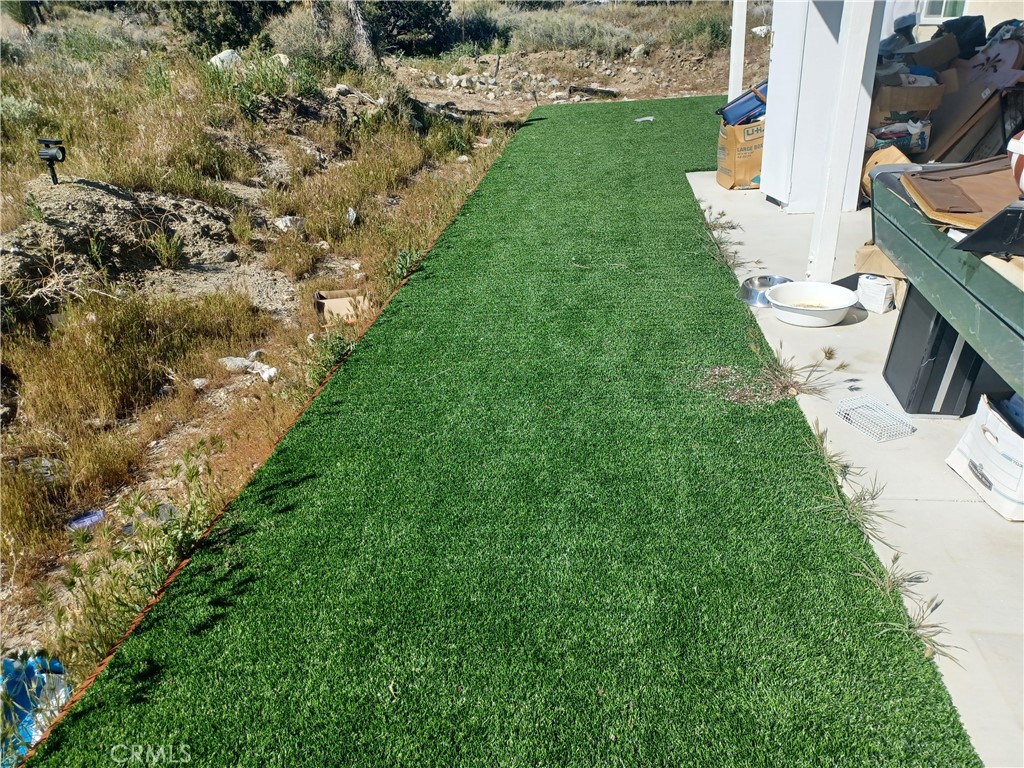 445 Solano Road Pinon Hills, CA 92372 - Photo 6 of 17 rear yard artifical grass