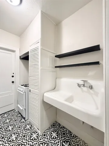 a bathroom with a sink a toilet and bathtub