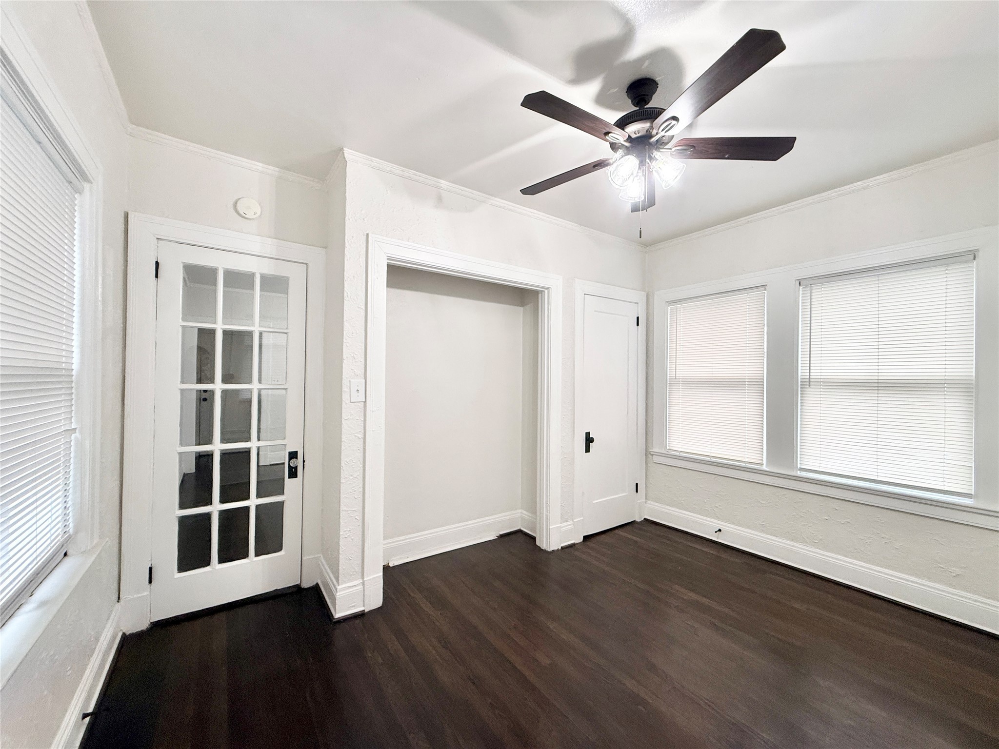 3920 Fannin Street, Unit 103 Houston, TX 77004 - Photo 15 of 24 a view of an empty room with wooden floor and a window