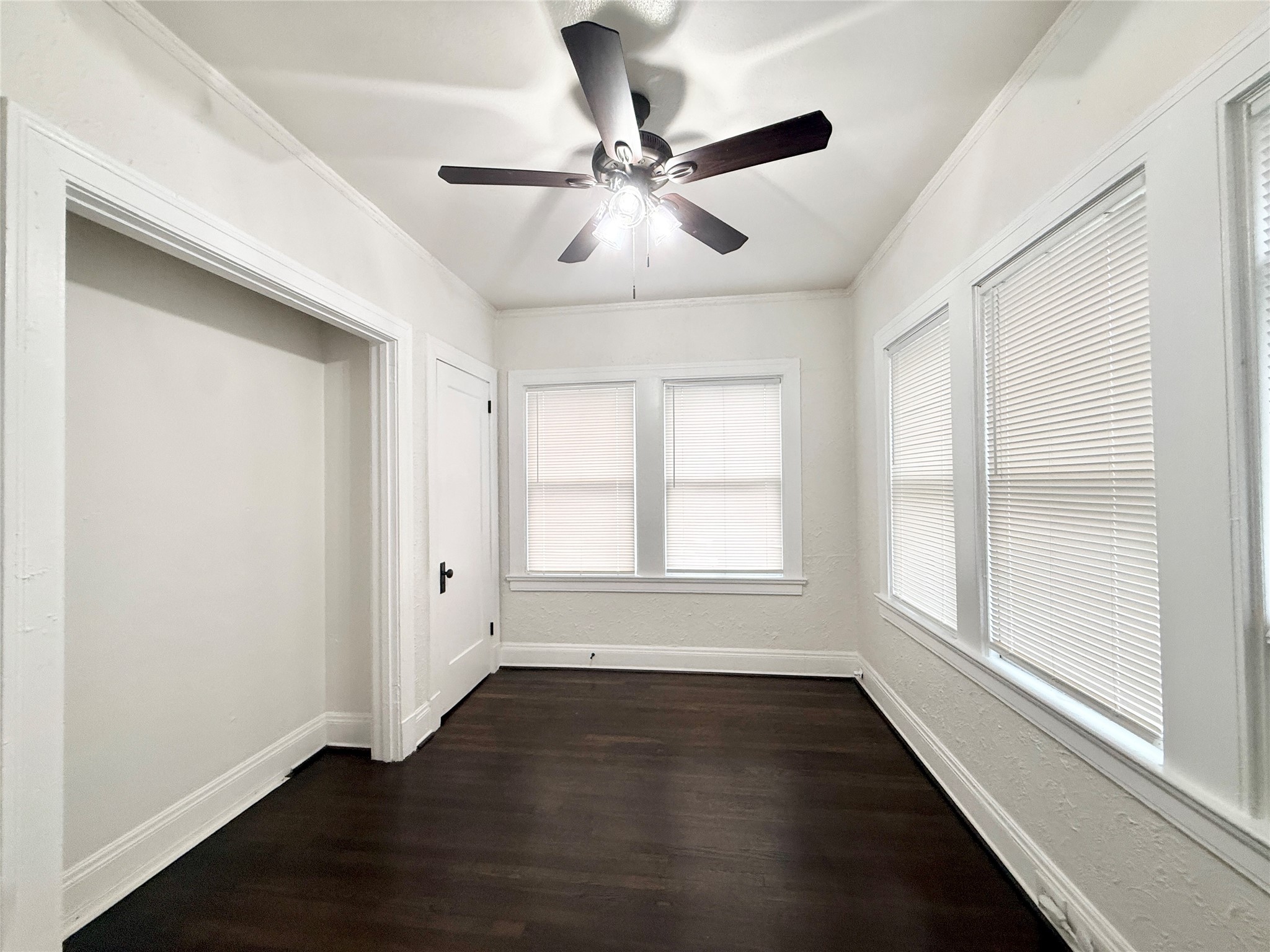 3920 Fannin Street, Unit 103 Houston, TX 77004 - Photo 16 of 24 a view of an empty room with wooden floor and a window