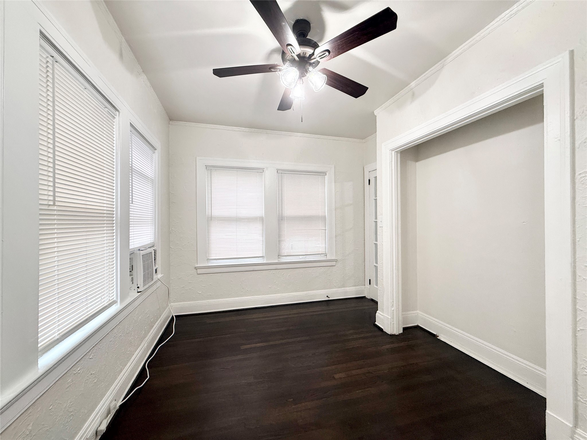 3920 Fannin Street, Unit 103 Houston, TX 77004 - Photo 17 of 24 a view of an empty room with wooden floor and a window