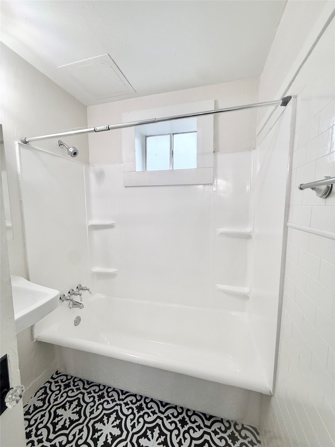 3920 Fannin Street, Unit 103 Houston, TX 77004 - Photo 22 of 24 a bathroom with a bathtub and a shower