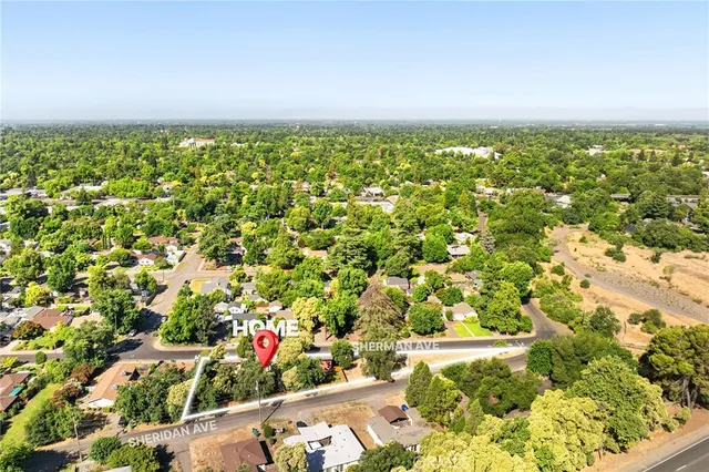 an aerial view of residential houses with outdoor space