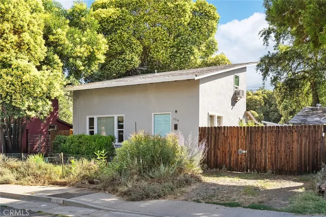 a house with trees in the background