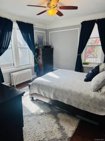 a bedroom with bed and window