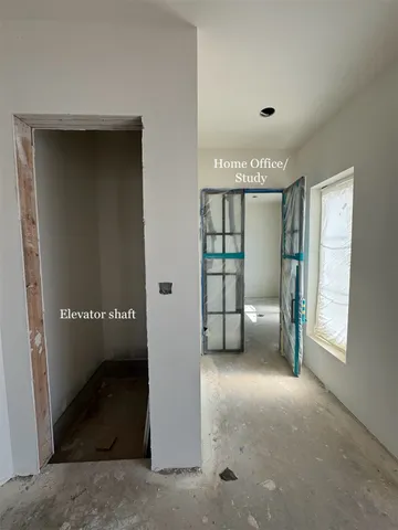 a kitchen with a stove a faucet and a dining table