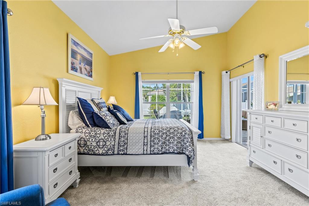 96 Glen Eagle Circle Naples, FL 34104 - Photo 11 of 33 a bedroom with a bed and wooden floor