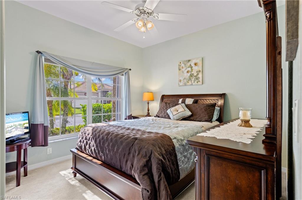 96 Glen Eagle Circle Naples, FL 34104 - Photo 14 of 33 a bedroom with a bed and a window