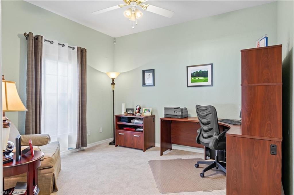 96 Glen Eagle Circle Naples, FL 34104 - Photo 17 of 33 a view of a workspace with furniture and a window