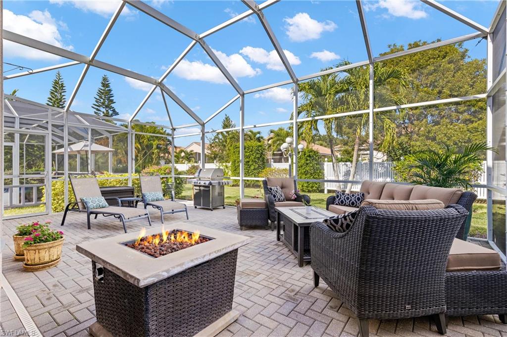 96 Glen Eagle Circle Naples, FL 34104 - Photo 21 of 33 a living room with patio furniture and a potted plant
