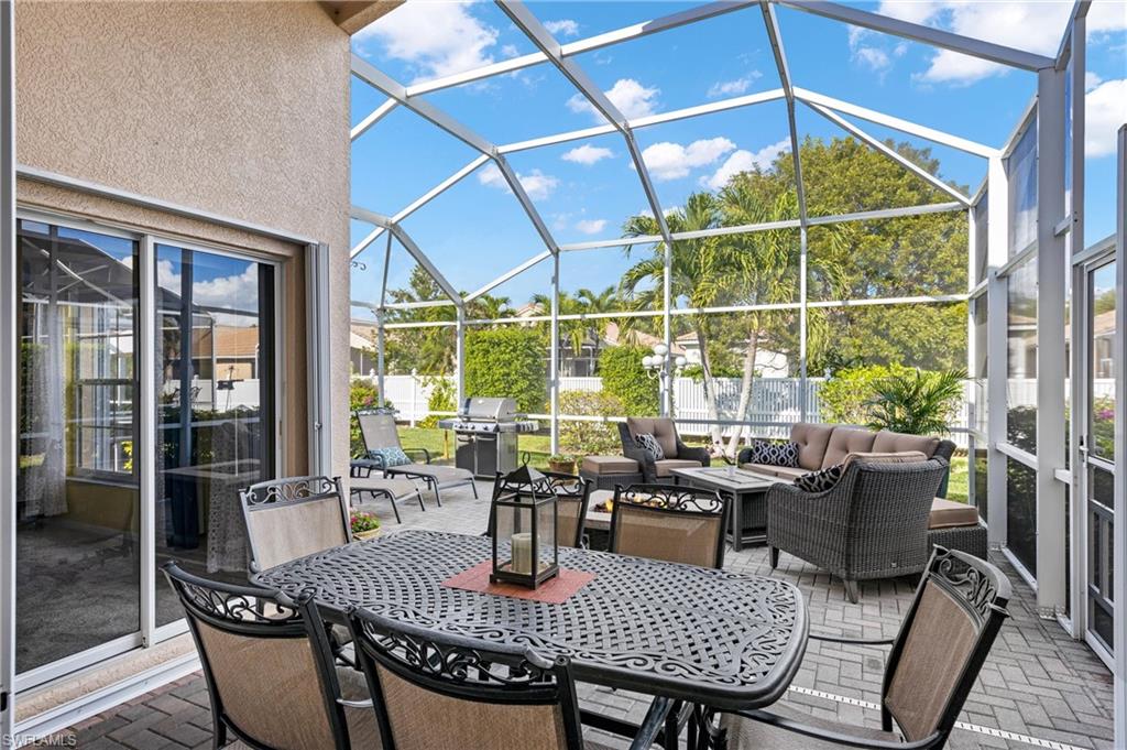 96 Glen Eagle Circle Naples, FL 34104 - Photo 22 of 33 a view of a dining room with furniture window and outside view