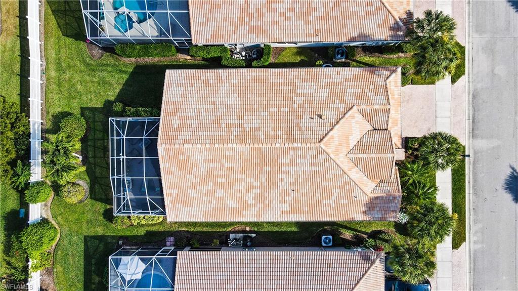 96 Glen Eagle Circle Naples, FL 34104 - Photo 25 of 33 an aerial view of a house with a yard and plants