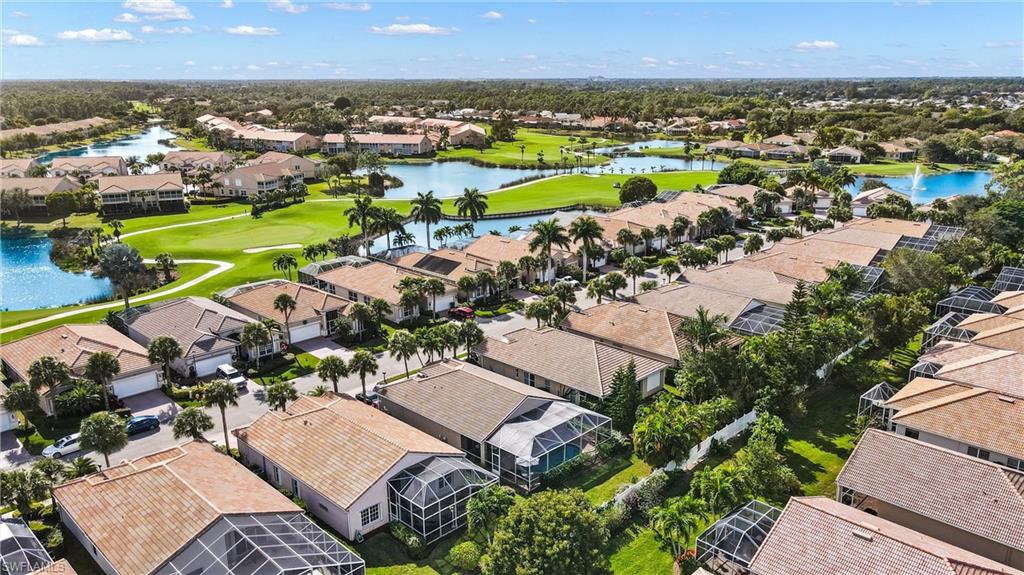 96 Glen Eagle Circle Naples, FL 34104 - Photo 26 of 33 an aerial view of a house with a swimming pool yard and outdoor seating