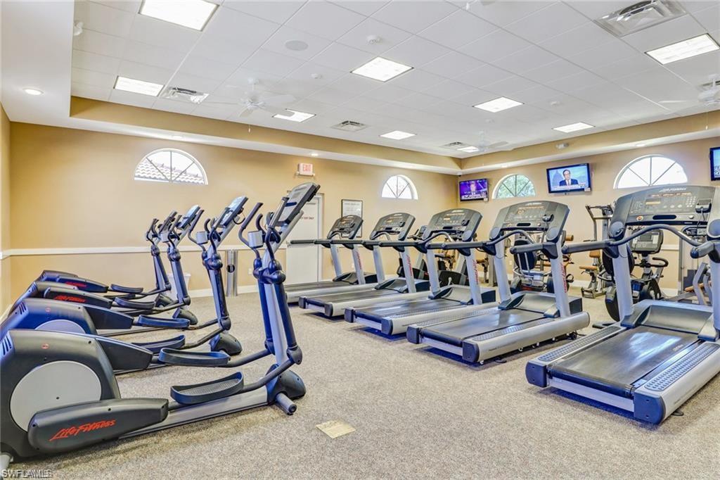96 Glen Eagle Circle Naples, FL 34104 - Photo 28 of 33 a view of a room with gym equipment