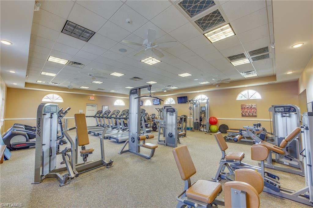 96 Glen Eagle Circle Naples, FL 34104 - Photo 30 of 33 a view of a room with gym equipment