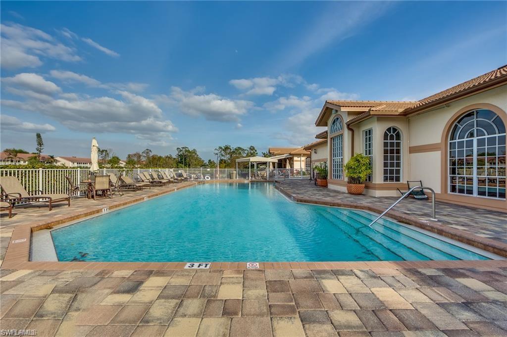 96 Glen Eagle Circle Naples, FL 34104 - Photo 31 of 33 a view of a house with a yard