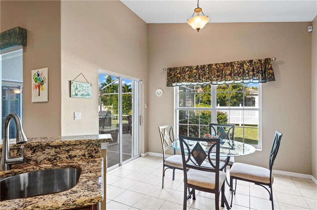 96 Glen Eagle Circle Naples, FL 34104 - Photo 9 of 33 a view of a dining room with furniture window and outside view