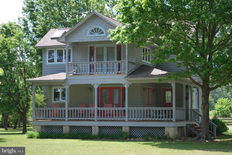 49588 Will's Road Dameron, MD 20628 - Photo 13 of 30 a front view of a house with a garden and yard
