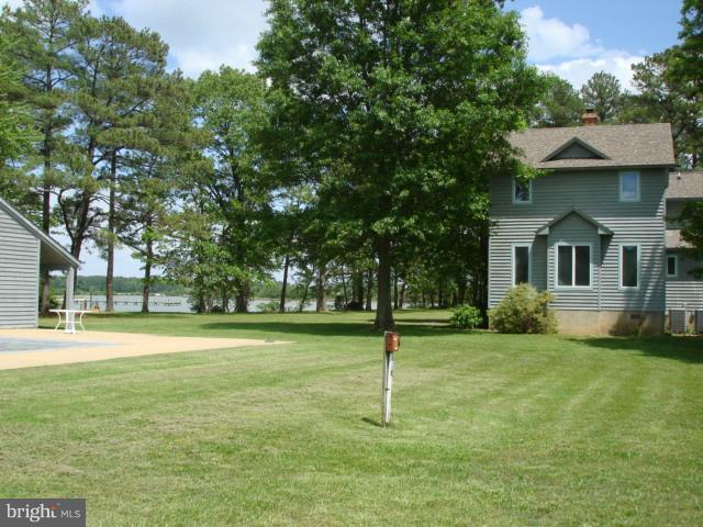 49588 Will's Road Dameron, MD 20628 - Photo 14 of 30 a view of a house with a backyard