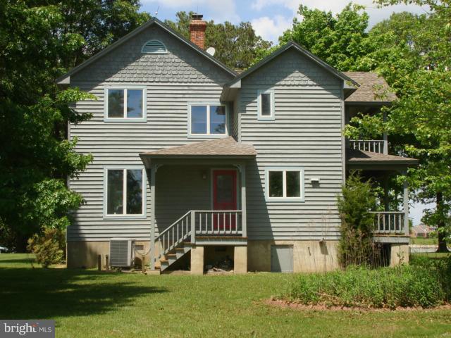 49588 Will's Road Dameron, MD 20628 - Photo 18 of 30 a front view of a house with a yard