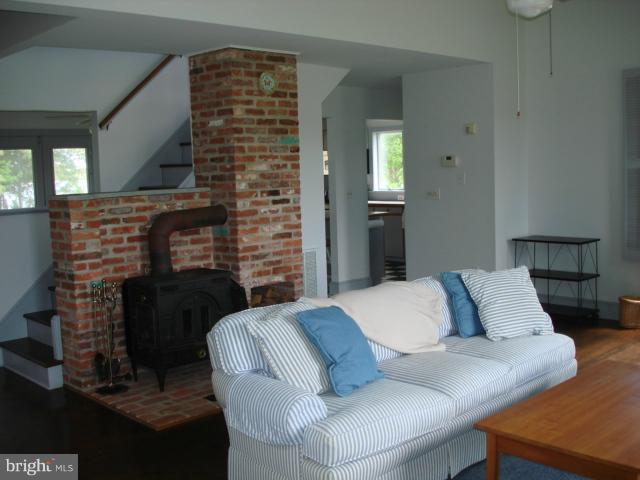 49588 Will's Road Dameron, MD 20628 - Photo 23 of 30 a living room with furniture and a fireplace