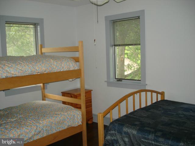 49588 Will's Road Dameron, MD 20628 - Photo 4 of 30 a bedroom with a bed and a window
