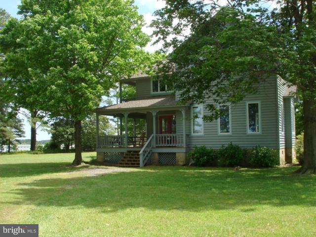 49588 Will's Road Dameron, MD 20628 - Photo 7 of 30 a front view of a house with a yard