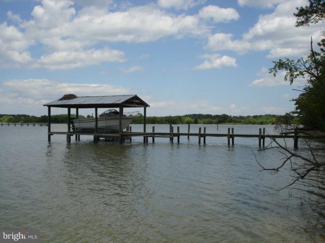 49588 Will's Road Dameron, MD 20628 - Photo 8 of 30 a view of a lake with furniture