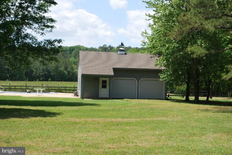 49588 Will's Road Dameron, MD 20628 - Photo 10 of 30 a view of a house with a yard and sitting area