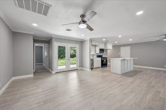 a view of a electric appliances in kitchen and wooden floor