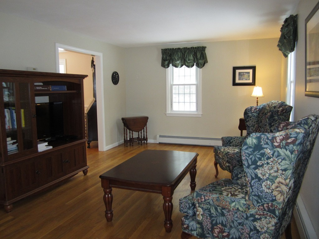 27 Janes Road Boxford, MA 01921 - Photo 8 of 15 a living room with furniture and a flat screen tv