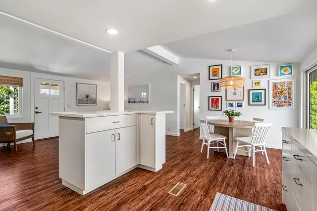 a kitchen with a sink stainless steel appliances and cabinets