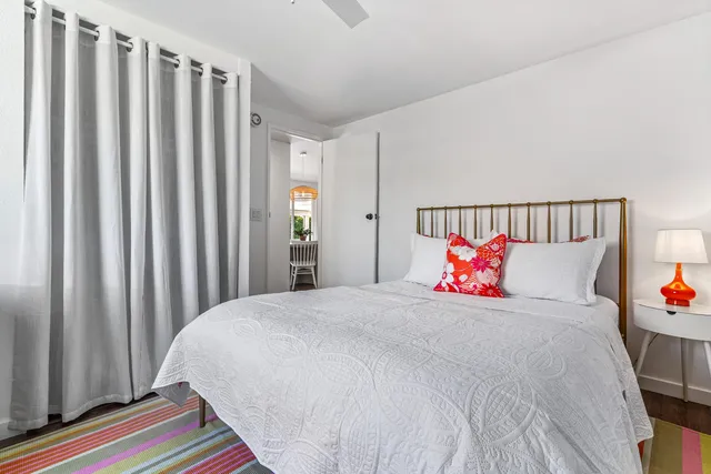 a living room with furniture and a dresser