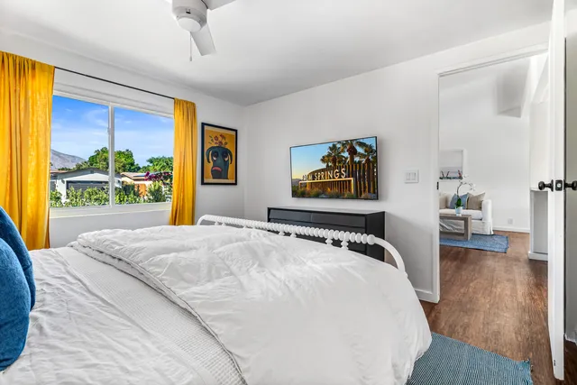 a bedroom with double bed and a window