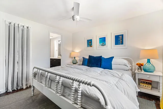 a bathroom with a sink a toilet a mirror and shower