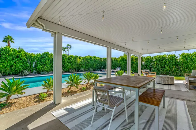 a outdoor living space with furniture and garden view