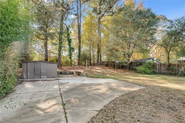 a view of a yard with trees