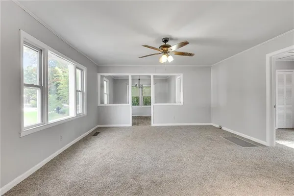 a view of an empty room with a window