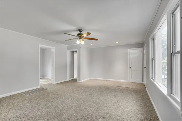 a view of an empty room with a window