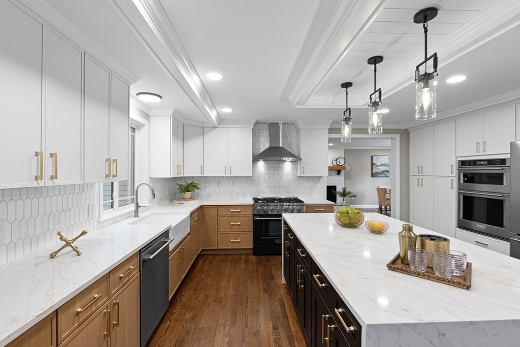 Lot 12 Brookside Lane Norfolk, MA 02056 - Photo 13 of 42 a open kitchen with kitchen island granite countertop a sink a counter space appliances and cabinets