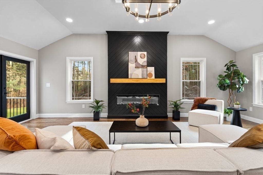 Lot 12 Brookside Lane Norfolk, MA 02056 - Photo 21 of 42 a living room with furniture and a fireplace