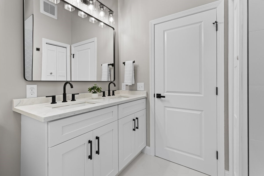 Lot 12 Brookside Lane Norfolk, MA 02056 - Photo 28 of 42 a bathroom with a sink and a mirror