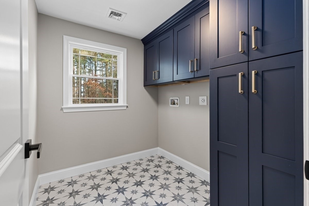 Lot 12 Brookside Lane Norfolk, MA 02056 - Photo 29 of 42 a view of an empty room with wooden floor and cabinets